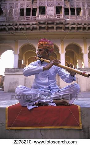 Man playing traditional wooden flute, Mehrangarh Fort; Jodhpur, Rajasthan, India View Large Photo Image Stock Image - Man playing traditional wooden flute, Mehrangarh Fort; Jodhpur, Rajasthan, India. Fotosearch