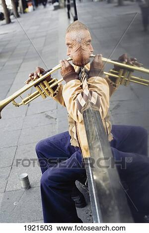Man Playing Trumpet In Street View Large Photo Image Stock Image - Man Playing Trumpet In Street. Fotosearch