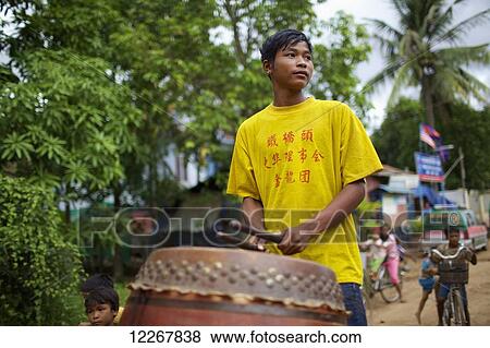 Man plays drums at a festival; Phnom Penh, Cambodia View Large Photo Image Stock Photo - Man plays drums at a festival; Phnom Penh, Cambodia. Fotosearch