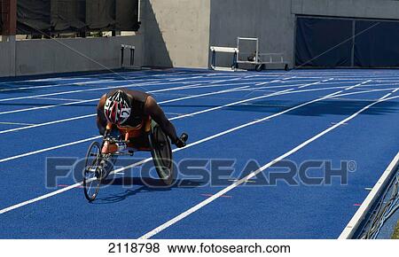 Man Racing In Wheelchair On Track; Toronto Ontario Canada View Large Photo Image Stock Photo - Man Racing In Wheelchair On Track; Toronto Ontario Canada. Fotosearch