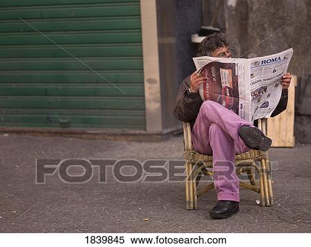 Stock Photography - Man Reading Newspaper; Naples, Italy. Fotosearch