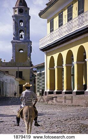 Man Riding Horse Near Colonial Buildings View Large Photo Image Stock Photo - Man Riding Horse Near Colonial Buildings. Fotosearch