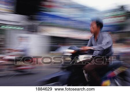 Man Riding Moped In Hanoi, Blurred Motion View Large Photo Image Stock Photo - Man Riding Moped In Hanoi, Blurred Motion. Fotosearch