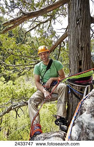 Stock Photo - Man rock climbing in the Adirondacks; New York, USA. Fotosearch