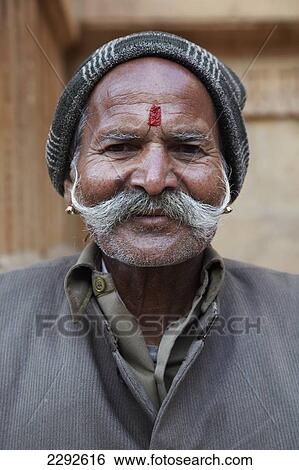 Man sat outside temple Jaisalmer Rajasthan India View Large Photo Image Stock Photograph - Man sat outside temple Jaisalmer Rajasthan India. Fotosearch