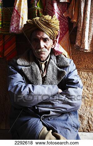 Man selling clothes in Jaisalmer Rajasthan India View Large Photo Image Stock Photo - Man selling clothes in Jaisalmer Rajasthan India. Fotosearch