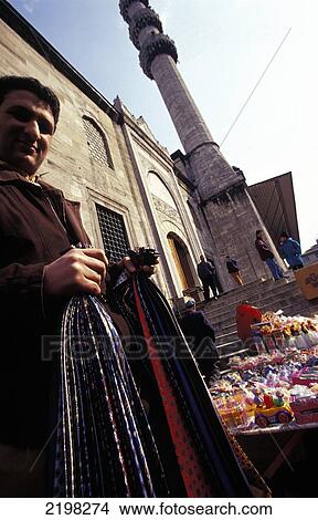 Man Selling Clothes, Street Market, Istanbul, Turkey. View Large Photo Image Picture - Man Selling Clothes, Street Market, Istanbul, Turkey.. Fotosearch
