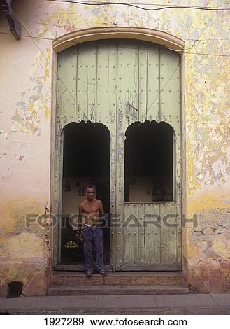 Man Selling Mangoes In Doorway Of House; Trinidad, Cuba View Large Photo Image Stock Photo - Man Selling Mangoes In Doorway Of House; Trinidad, Cuba. Fotosearch