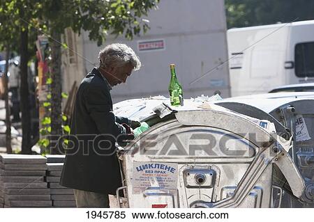 Man sifting through a rubbish bin, Sofia, Bulgaria View Large Photo Image Stock Photography - Man sifting through a rubbish bin, Sofia, Bulgaria. Fotosearch