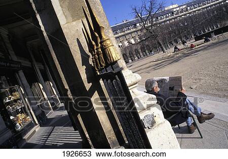 Stock Image - Man Sitting And Reading, De Palais. Fotosearch