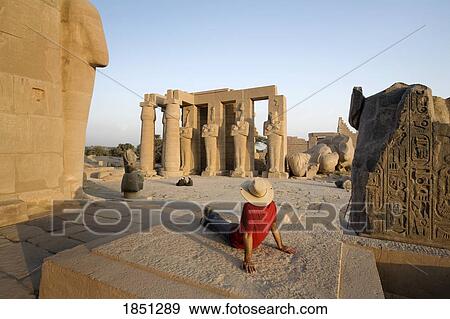 Man Sitting At Temple In Luxor View Large Photo Image Stock Photo - Man Sitting At Temple In Luxor. Fotosearch