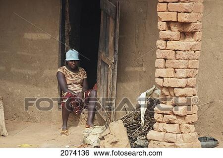Man Sitting In Front Of His Home In Ambalavao, Fianarantsoa Province, Madagascar View Large Photo Image Stock Photograph - Man Sitting In Front Of His Home In Ambalavao, Fianarantsoa Province, Madagascar. Fotosearch