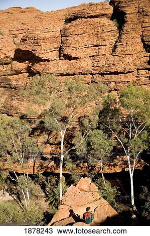 Stock Image - Man Sitting In Gorge At Kings Canyon. Fotosearch