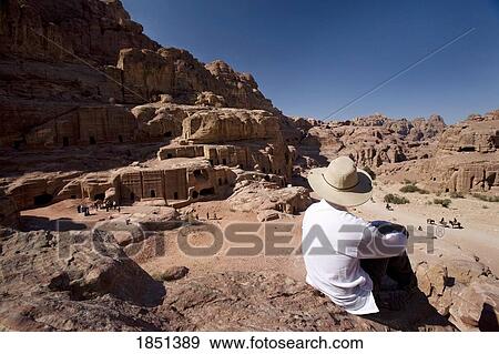 Man Sitting Near Monumental Nabataean Tombs View Large Photo Image Stock Photo - Man Sitting Near Monumental Nabataean Tombs. Fotosearch