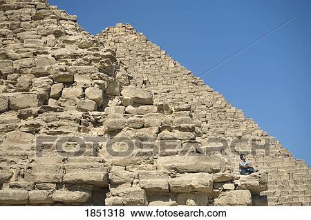 Man Sitting On Part Of A Pyramid In The Desert View Large Photo Image Stock Photo - Man Sitting On Part Of A Pyramid In The Desert. Fotosearch