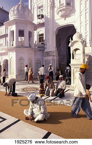 Man Sitting On Rug With People Behind, Golden Temple, Amritar View Large Photo Image Stock Photograph - Man Sitting On Rug With People Behind, Golden Temple, Amritar. Fotosearch