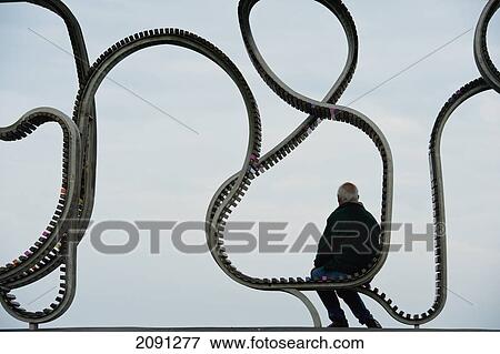 Man Sitting On 'the Longest Bench', Littlehampton, West Sussex, Uk View Large Photo Image Stock Photo - Man Sitting On 'the Longest Bench', Littlehampton, West Sussex, Uk. Fotosearch