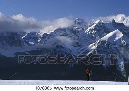 Stock Photography - Man Skiing In Mountains. Fotosearch