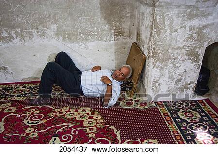 Stock Photo - Man Sleeping On The Floor Of St. Bishoy Monastery, Wadi El Natrun, Egypt. Fotosearch