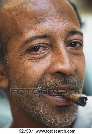 Man Smoking Cigar On Streets View Large Photo Image Stock Photo - Man Smoking Cigar On Streets. Fotosearch