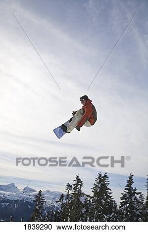 Man Snowboarding, Jumping In Mid-Air; Vancouver Island Ranges, British Columbia, Canada View Large Photo Image Stock Image - Man Snowboarding, Jumping In Mid-Air; Vancouver Island Ranges, British Columbia, Canada. Fotosearch