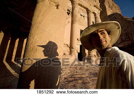 Man Standing Amidst Royal Tombs In Petra View Large Photo Image Stock Image - Man Standing Amidst Royal Tombs In Petra. Fotosearch