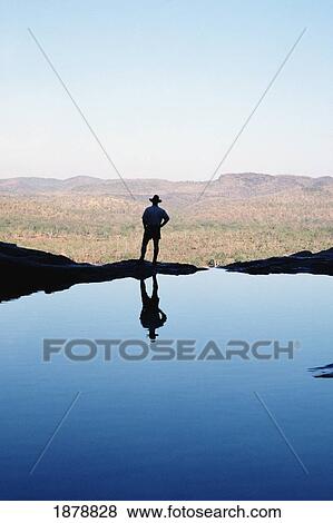 Man Standing Beside A Pool View Large Photo Image Stock Photo - Man Standing Beside A Pool. Fotosearch