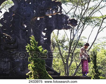 Man standing by a staircase of the Mother Temple of Besakih, Bali, Indonesia View Large Photo Image Stock Photography - Man standing by a staircase of the Mother Temple of Besakih, Bali, Indonesia. Fotosearch