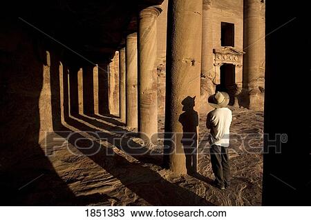 Man Standing By Royal Tomb In Petra View Large Photo Image Stock Image - Man Standing By Royal Tomb In Petra. Fotosearch
