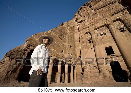 Man Standing By Royal Tomb In Petra View Large Photo Image Stock Photography - Man Standing By Royal Tomb In Petra. Fotosearch