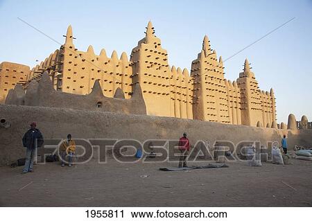 Man Standing In Front Of The Grand Mosque At Djenne, Mali View Large Photo Image Stock Image - Man Standing In Front Of The Grand Mosque At Djenne, Mali. Fotosearch
