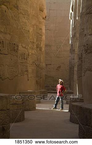 Stock Image - Man Standing In The Temple Of Karnak. Fotosearch