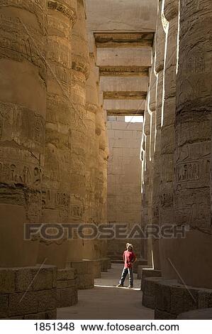 Stock Photo - Man Standing In The Temple Of Karnak. Fotosearch