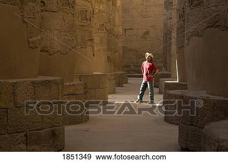 Stock Photo - Man Standing In The Temple Of Karnak; Luxor, Egypt. Fotosearch
