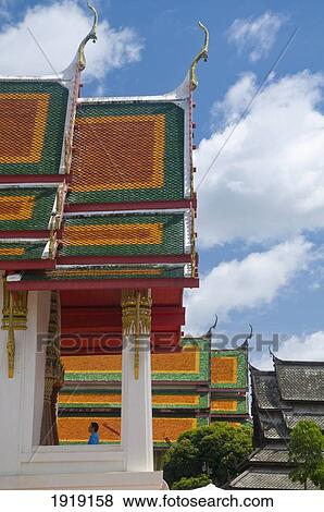 Stock Photo - Man Standing In Thung Sri Muang Temple. Fotosearch