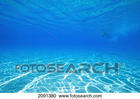 Stock Image - Man Swimming In The Pells Pool, Lewes, East Sussex, Uk. Fotosearch