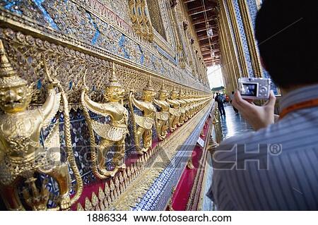 Picture - Man Taking Pictures On The Bot Of Wat Phra Kaeo. Fotosearch