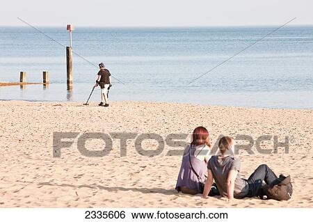 Man Using Metal Detector On Beach; Bournemouth, Dorset, England, Uk View Large Photo Image Stock Photograph - Man Using Metal Detector On Beach; Bournemouth, Dorset, England, Uk. Fotosearch