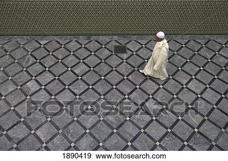 Man Walking Across Floor Of Moulay Idriss Mosque View Large Photo Image Stock Photo - Man Walking Across Floor Of Moulay Idriss Mosque. Fotosearch