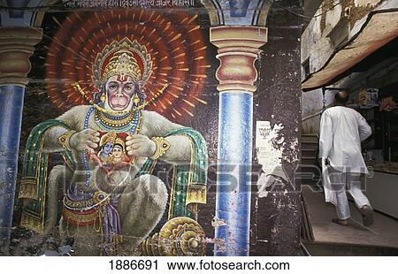Man Walking Beside Wall Mural Of Hanuman Along The Streets Of Godaulia View Large Photo Image Stock Image - Man Walking Beside Wall Mural Of Hanuman Along The Streets Of Godaulia. Fotosearch