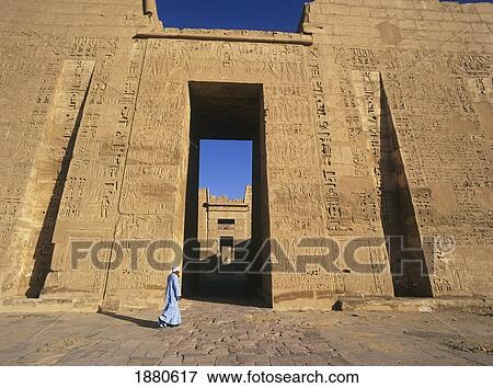 Man Walking By Medina Habu Temple View Large Photo Image Stock Photo - Man Walking By Medina Habu Temple. Fotosearch