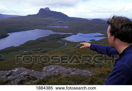 Stock Photography - Man Walking In Inverpolly National Nature Reserve. Fotosearch