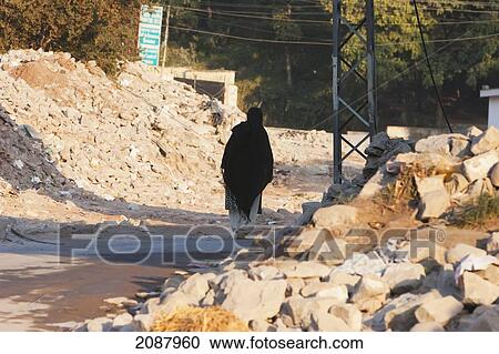 Man Walking In The Rubble After The 8 October 2005 Earthquake, Muzaffarabad, Azad Kashmir, Pakistan View Large Photo Image Stock Image - Man Walking In The Rubble After The 8 October 2005 Earthquake, Muzaffarabad, Azad Kashmir, Pakistan. Fotosearch