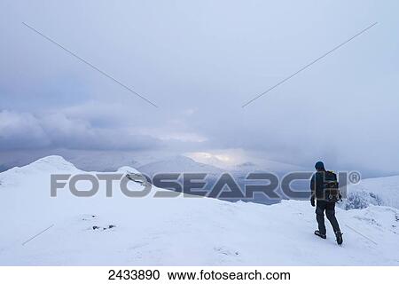 Man walking on Beinn Dorain in snowy, winter conditions, near Bridge of Orchy; Argyll and Bute, Scotland View Large Photo Image Stock Image - Man walking on Beinn Dorain in snowy, winter conditions, near Bridge of Orchy; Argyll and Bute, Scotland. Fotosearch