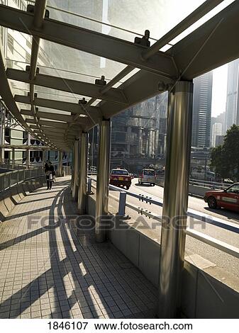 Man Walking On Overpass In Kowloon District; Asia View Large Photo Image Stock Photo - Man Walking On Overpass In Kowloon District; Asia. Fotosearch