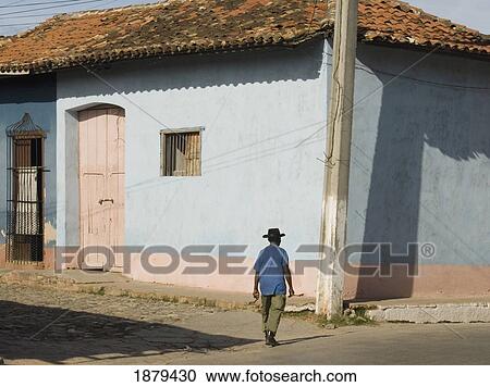 Man Walking Past Colourfully Painted Houses View Large Photo Image Stock Image - Man Walking Past Colourfully Painted Houses. Fotosearch