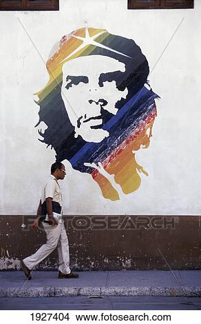 Man Walking Past Image Of Che Guevera View Large Photo Image Picture - Man Walking Past Image Of Che Guevera. Fotosearch