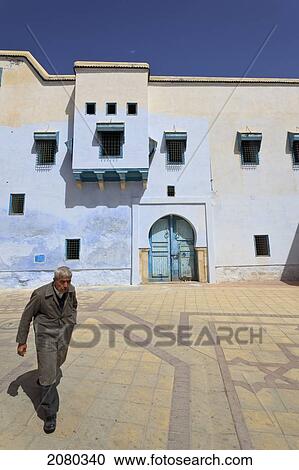 Man Walking Through City Back Streets; Kairouan, Tunisia, North Africa View Large Photo Image Stock Image - Man Walking Through City Back Streets; Kairouan, Tunisia, North Africa. Fotosearch