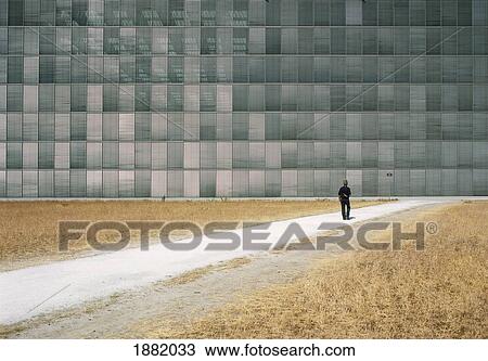Man Walking Towards New Office Building View Large Photo Image Stock Image - Man Walking Towards New Office Building. Fotosearch
