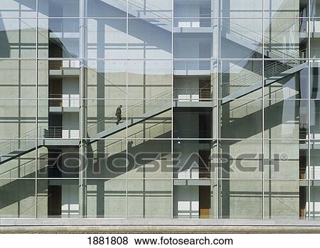 Man Walking Up Stairs In Modern Office Building Beside River Spree View Large Photo Image Stock Photo - Man Walking Up Stairs In Modern Office Building Beside River Spree. Fotosearch